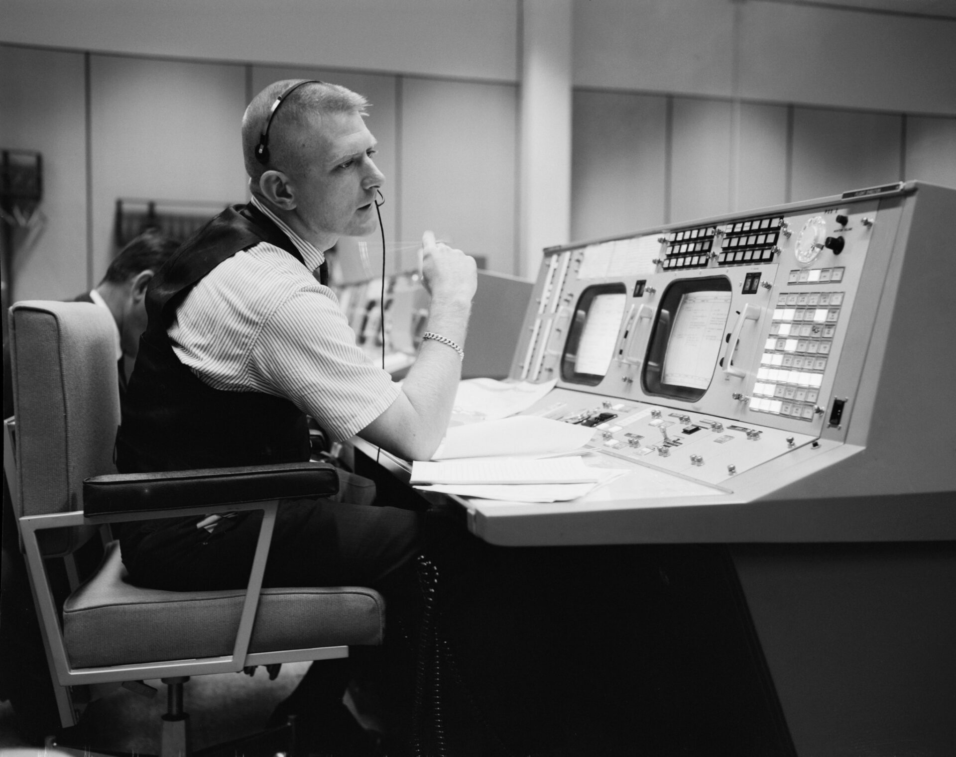 tumblr_5d967c2ad1572c21c5b0b9c6cb1f023e_f55ce52f_2048 A control room operator monitors gauges and switches, the kind of grid infrastructure now strained by AI data center power demand.