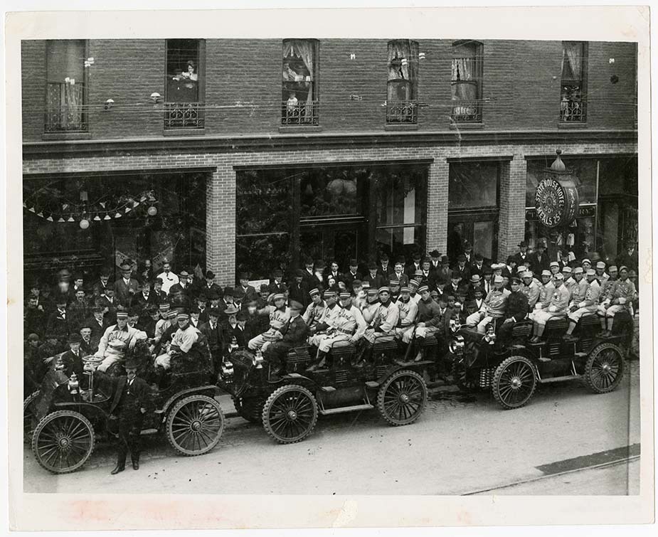 Gelatin silver copyprint Archival black and white photograph of a large fleet of new vehicles lined up, illustrating a company's large-scale bet on new infrastructure