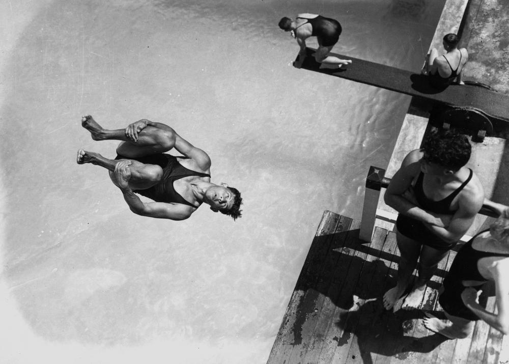 tumblr_ovuy7it6Uc1sfie3io1_1280 Archival black and white photograph of a diver mid-plunge, illustrating the market's uncertain leap on Federal Reserve policy direction